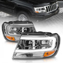ANZO 1999-2004 Jeep Grand Cherokee Crystal Headlights w/ Light Bar Chrome Housing-1