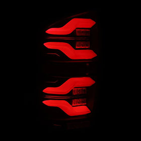 AlphaRex 16-21 Toyota Tacoma LUXX LED Taillights Alpha Blk w/Activ Light/Seq Signal - 0