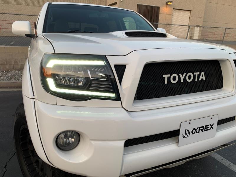 AlphaRex 05-11 Toyota Tacoma LUXX Crystal Headlights Plank Style Design Black w/Activation Light/DRL