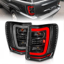 ANZO 1999-2004 Jeep Grand Cherokee LED Tail Lights w/ Light Bar Black Housing Clear Lens-1