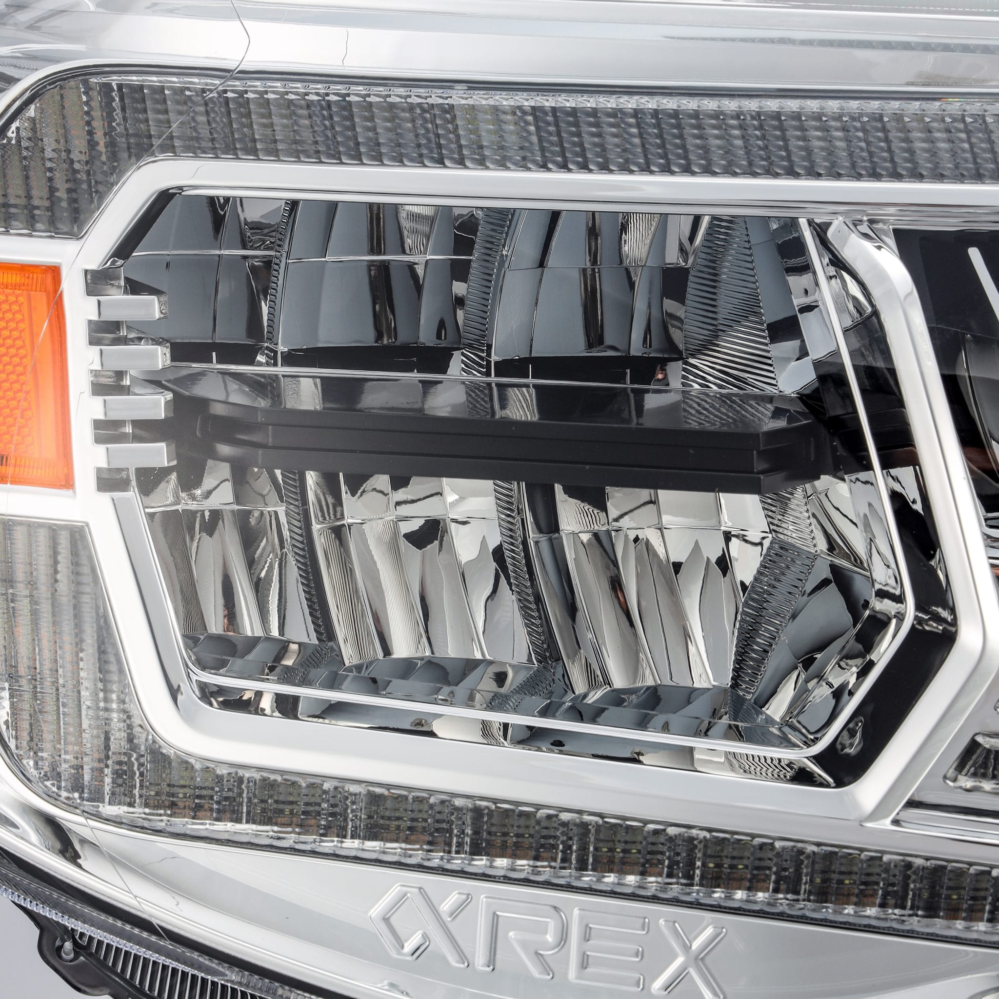 AlphaRex 05-11 Toyota Tacoma LUXX Crystal Headlights Plank Style Chrome w/Activation Light/DRL - 0