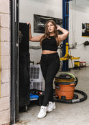 Model wearing pizzabrand Imola Yellow Audi B5 RS4 crop top in black.