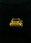 A black Audi crop top for women. Photo is a close up view of the top with an embroidered imola yellow Audi B5 RS4. Fabric composition is polyester, and elastine. The material is stretchy, ribbed, and non-transparent. The style of this shirt is sleeveless, with a crewneck neckline.