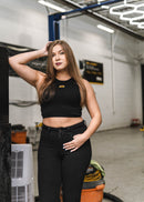 Model wearing pizzabrand Imola Yellow Audi B5 RS4 crop top in black.