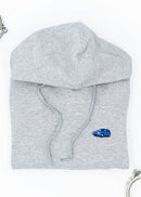 A grey Audi unisex hoodie for men and women. Photo is a front view of the sweater with an embroidered Nogaro Blue Audi 80 RS2 Avant made by Porsche. Fabric composition is cotton, polyester, and rayon. The material is very soft, stretchy, and non-transparent. The style of this hoodie is long sleeve, crewneck with a hood, hooded, with embroidery on the left chest.