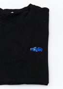 A black Audi t-shirt for men. Photo is a close up of the shirt with an embroidered a Nogaro Blue Audi 80 Avant made by Porsche. Fabric composition is 100% polyester. The material is very soft, stretchy, non-transparent. The style of this shirt is short sleeve, with a crewneck neckline.