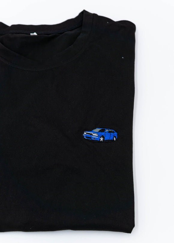 A black Audi t-shirt for men. Photo is a close up of the shirt with an embroidered a Nogaro Blue Audi 80 Avant made by Porsche. Fabric composition is 100% polyester. The material is very soft, stretchy, non-transparent. The style of this shirt is short sleeve, with a crewneck neckline.