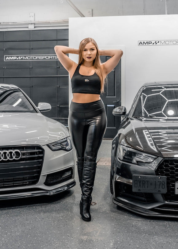 A model posing with pizzabrand Audi Sport Quattro S1 E2 crop top in black.