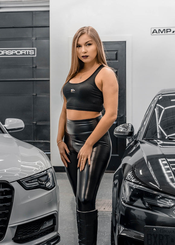 A model posing with pizzabrand Audi Sport Quattro S1 E2 crop top in black.