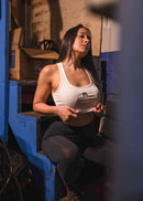 A model posing with pizzabrand Audi Sport Quattro S1 E2 crop top in white.