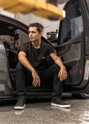 Model wearing pizzabrand white BMW 2002 Turbo t-shirt in black.