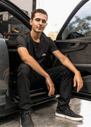 Model wearing pizzabrand white BMW 2002 Turbo t-shirt in black.