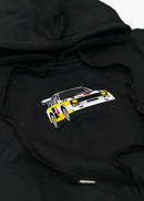 A black Audi cropped hoodie for women. Photo is a front view of the cropped sweater with an embroidered Sport Quattro S1 E2. Fabric composition is cotton, and polyester. The material is soft, stretchy, and non-transparent. The style of this crop hoodie is long sleeve, crewneck with a hood, hooded, with embroidery on the chest.