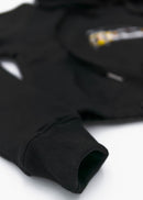A black Audi cropped hoodie for women. Photo is a front view of the cropped sweater with an embroidered Sport Quattro S1 E2. Fabric composition is cotton, and polyester. The material is soft, stretchy, and non-transparent. The style of this crop hoodie is long sleeve, crewneck with a hood, hooded, with embroidery on the chest.