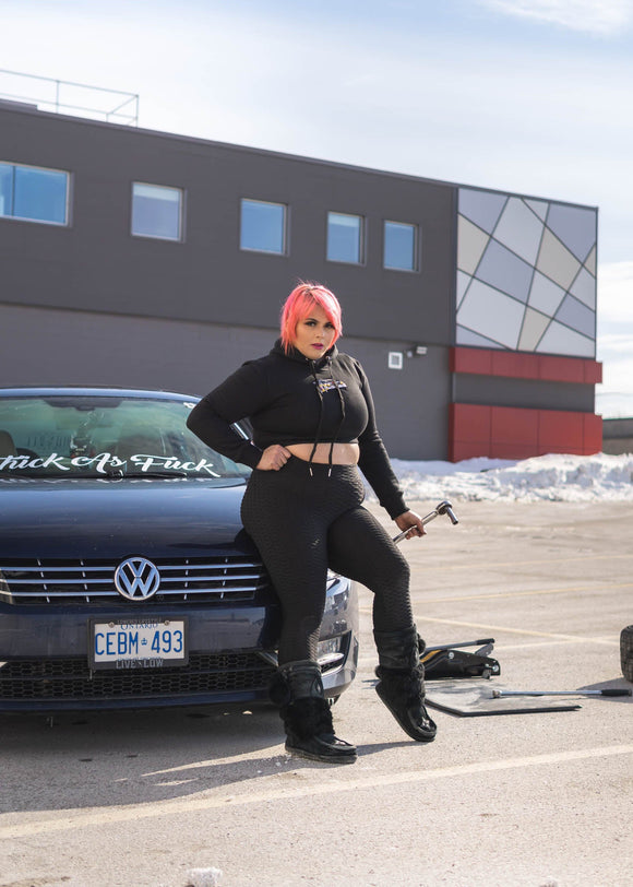 Model posing in pizzabrand Audi Sport quattro S1 E2 cropped hoodie.