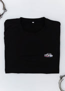 A black BMW 2002 Turbo t-shirt for men. Photo is a close up view of the shirt with an embroidered 2002 Turbo. Fabric composition is a polyester and cotton mix. The material is very soft, stretchy, non-transparent. The style of this shirt is short sleeve, with a crewneck neckline.