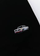 A black BMW 2002 Turbo t-shirt for men. Photo is a close up view of the shirt with an embroidered 2002 Turbo. Fabric composition is a polyester and cotton mix. The material is very soft, stretchy, non-transparent. The style of this shirt is short sleeve, with a crewneck neckline.