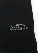 A Black RWB Porsche 930 911 Turbo T-Shirt for men. Photo is a close up view of the shirt with Akira Nakai's RWB Porsche 930 911 Turbo Stella Artois. Fabric composition is a polyester, and cotton mix. The material is very stretchy, soft, comfortable, and non-transparent. The style of this shirt is short sleeve, with a crewneck neckline.