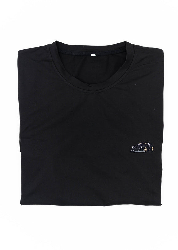 A Black RWB Porsche 930 911 Turbo T-Shirt for men. Photo is a close up view of the shirt with Akira Nakai's RWB Porsche 930 911 Turbo Stella Artois. Fabric composition is a polyester, and cotton mix. The material is very stretchy, soft, comfortable, and non-transparent. The style of this shirt is short sleeve, with a crewneck neckline.