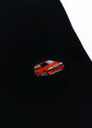 A black Volvo crewneck sweater for men. Photo is a close up of the sweater with an embroidered 850R. Fabric is composed of high quality 80% cotton, and 20% polyester and fits to size. The style is long sleeve, crew neck, and embroidery on left chest.