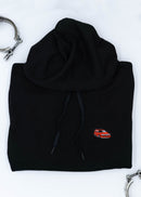 A black Volvo unisex hoodie for men and women. Photo is a close up view of the sweater with an embroidered Volvo 850R. Fabric composition is cotton, polyester, and rayon. The material is very soft, stretchy, and non-transparent. The style of this hoodie is long sleeve, crewneck with a hood, hooded, with embroidery on the left chest.