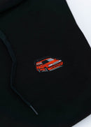 A black Volvo unisex hoodie for men and women. Photo is a close up view of the sweater with an embroidered Volvo 850R. Fabric composition is cotton, polyester, and rayon. The material is very soft, stretchy, and non-transparent. The style of this hoodie is long sleeve, crewneck with a hood, hooded, with embroidery on the left chest.