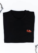 A black Volvo t-shirt for men. Photo is a close up view of the shirt with an embroidered red 850R. Fabric composition is a polyester, and cotton mix. The material is very soft, stretchy, non-transparent. The style of this shirt is short sleeve, with a crewneck neckline.
