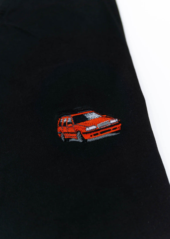 A black Volvo t-shirt for men. Photo is a close up view of the shirt with an embroidered red 850R. Fabric composition is a polyester, and cotton mix. The material is very soft, stretchy, non-transparent. The style of this shirt is short sleeve, with a crewneck neckline.