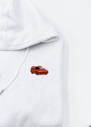 A white Volvo cropped hoodie for women. Photo is a close up view of the cropped sweater with an embroidered 850R. Fabric composition is 100% cotton. The material is soft, comfortable, breathable, and non-transparent. The style of this crop hoodie is long sleeve, crewneck with a hood, hooded, with embroidery on the chest.