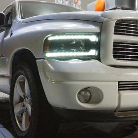 AlphaRex 02-05 Dodge Ram 1500 PRO-Series Projector Headlights Plank Style Alpha Black w/Seq Signal - 0