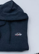 A dark blue BMW unisex hoodie for men and women. Photo is a close up view of the sweater with an embroidered BMW 2002 Turbo. Fabric composition is cotton, polyester, and rayon. The material is very soft, stretchy, and non-transparent. The style of this hoodie is long sleeve, crewneck with a hood, hooded, with embroidery on the left chest.