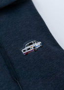 A dark blue BMW unisex hoodie for men and women. Photo is a close up view of the sweater with an embroidered BMW 2002 Turbo. Fabric composition is cotton, polyester, and rayon. The material is very soft, stretchy, and non-transparent. The style of this hoodie is long sleeve, crewneck with a hood, hooded, with embroidery on the left chest.