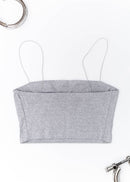 A grey Audi crop top for women. Photo is a back view of the shirt with an embroidered Black Audi D2 S8. Fabric composition is 100% polyester. The material is very soft, comfortable, non-transparent. The style of this shirt is sleeveless, spaghetti straps, with a straight neckline.