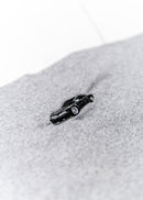 A grey Audi crop top for women. Photo is a close up view of the shirt with an embroidered Black Audi D2 S8. Fabric composition is 100% polyester. The material is very soft, comfortable, non-transparent. The style of this shirt is sleeveless, spaghetti straps, with a straight neckline.