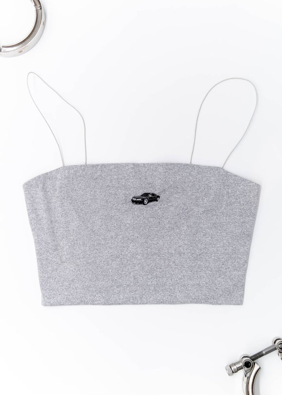 A grey Audi crop top for women. Photo is a front view of the shirt with an embroidered Black Audi D2 S8. Fabric composition is 100% polyester. The material is very soft, comfortable, non-transparent. The style of this shirt is sleeveless, spaghetti straps, with a straight neckline.