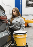Model wearing pizzabrand black Mercedes-Benz W201 190E Evo II cropped hoodie in grey.