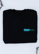 A black Park Auto Motorsports crewneck sweater for men. Photo is a close up of the sweater with an embroidered logo. Fabric is composed of high quality 80% cotton, and 20% polyester and fits to size. The style is long sleeve, crew neck, and embroidery on left chest.