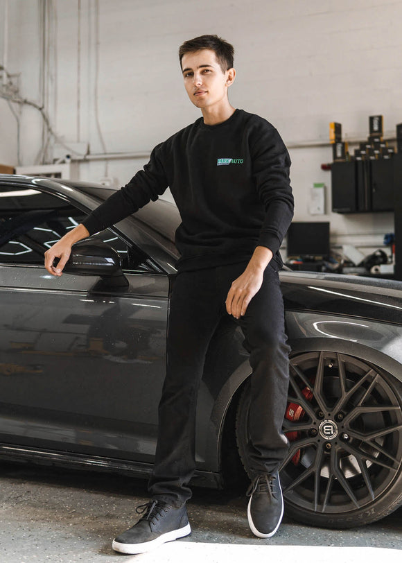 Model wearing Park Auto Motorsports crewneck in black.