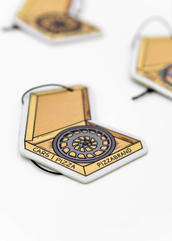 A pizzabrand pizza box with wheels multipack sampler pack air fresheners. Photo is a close up of the Rotiform CCV wheel air freshener with string. 