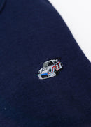 A navy blue Porsche race car crewneck sweater for men. Photo is a close up of the sweater with an embroidered Martini R13 Porsche 911 Carrera RSR 2.1 Turbo . Fabric is 100% cotton and high quality and fits to size. The style is long sleeve, crew neck, and embroidery on left chest.
