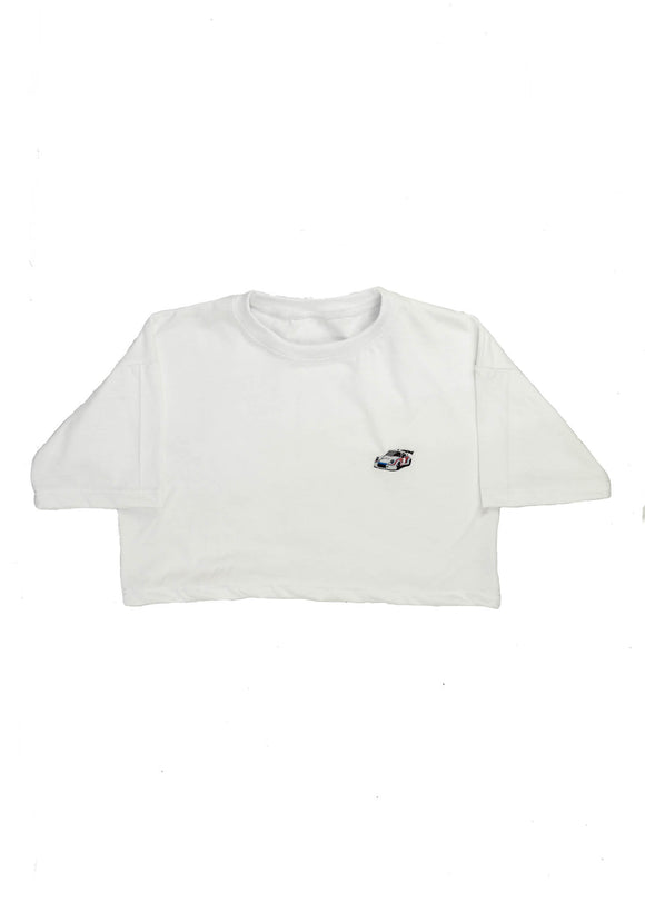 A black Audi t-shirt for men. Photo is the front of the shirt with an embroidered Martini R13 Porsche 911 Carrera RSR 2.1 Turbo. Fabric composition is a polyester, and cotton mix. The material is very soft, stretchy, non-transparent. The style of this shirt is short sleeve, with a crewneck neckline.
