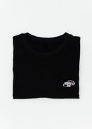 Close up of an embroidered R13 1974 911 RSR Turbo on a women's high quality cropped t-shirt. Photo shows the detailed embroidery of a R13 1974 911 RSR Turbo. Fabric composition of this tee is 100% cotton. The material is very soft, stretchy, and non-transparent. The style of this tshirt is a crewneck, short sleeve, cropped at the waist, with embroidery on the left chest.