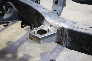 RustBust 05-15 Toyota Tacoma Access Cab and Crew Cab Front Body Mount Left