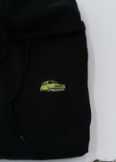 A black VW Volkswagen unisex hoodie for men and women. Photo is a close up of the sweater with an embroidered modified green Mk1 Golf. Fabric composition is cotton, polyester, and rayon. The material is very soft, stretchy, and non-transparent. The style of this hoodie is long sleeve, crewneck with a hood, hooded, with embroidery on the left chest.