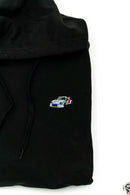 A black 911 RSR racing unisex hoodie for men and women. Photo is a close up view of the sweater with an embroidered Martini R13 911 RSR 2.1 Turbo. Fabric composition is cotton, polyester, and rayon. The material is very soft, stretchy, and non-transparent. The style of this hoodie is long sleeve, crewneck with a hood, hooded, with embroidery on the left chest.