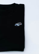A black 911 RSR 2.1 Turbo T-Shirt for men. Photo is a close up view of the shirt with an embroidered 911 RSR 2.1 Turbo. Fabric composition is 65% polyester, and 35% cotton. The material is very stretchy, soft, comfortable, breathable, and non-transparent. The style of this shirt is short sleeve, with a crewneck neckline.
