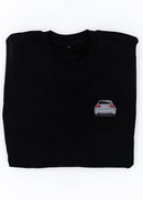 A black B7 RS4 crewneck sweater for men. Photo is a close up view of the sweater with an embroidered B7 RS4. Fabric is a cotton and polyester mix and high quality and fits to size. The style is long sleeve, crew neck, and embroidery on left chest.