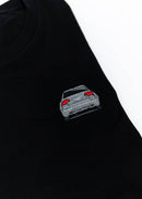 A black B7 RS4 T-Shirt for men. Photo is a close up of the shirt with an embroidered B7 RS4. Fabric composition is 65% polyester, and 35% cotton. The material is very stretchy, soft, comfortable, breathable, and non-transparent. The style of this shirt is short sleeve, with a crewneck neckline.