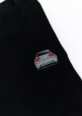 A black B7 RS4 T-Shirt for men. Photo is a close up of the shirt with an embroidered B7 RS4. Fabric composition is 65% polyester, and 35% cotton. The material is very stretchy, soft, comfortable, breathable, and non-transparent. The style of this shirt is short sleeve, with a crewneck neckline.