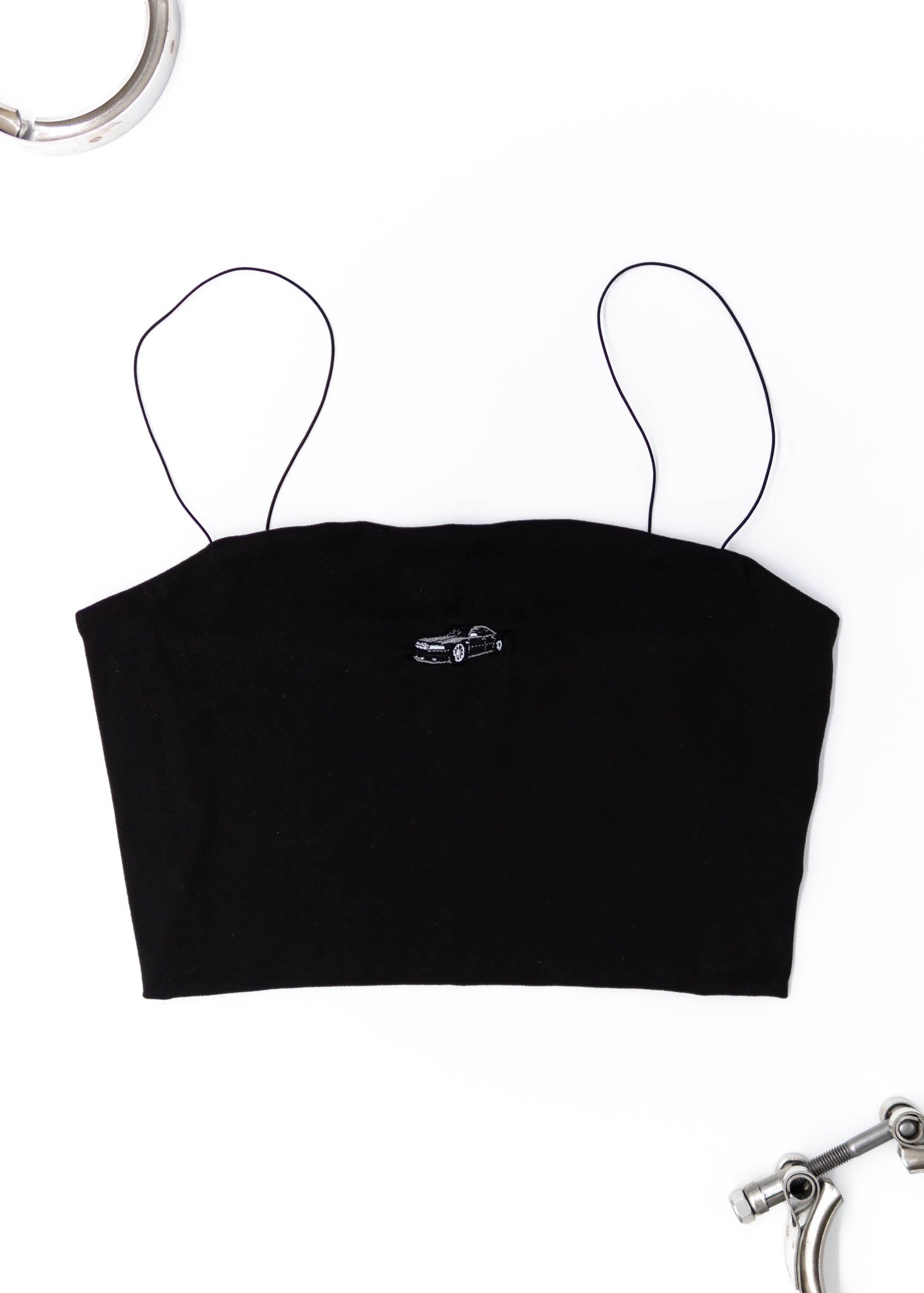 A black Audi crop top for women. Photo is a front view of the shirt with an embroidered Black Audi D2 S8. Fabric composition is 100% polyester. The material is very soft, comfortable, non-transparent. The style of this shirt is sleeveless, spaghetti straps, with a straight neckline.